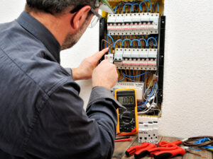 electrician fixing a circuit breaker
