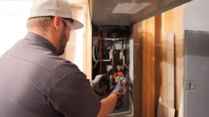 JP Electrical technician installing a new 200 amp electrical panel on a Wasatch Front home